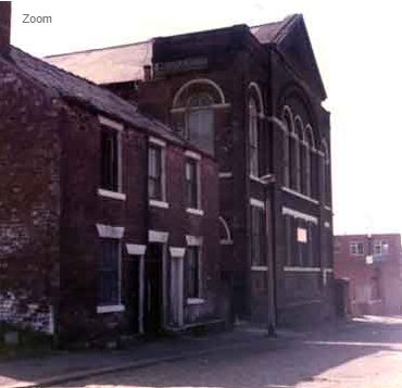 Side view of the masjid in 1984 with adjoining terraced housing