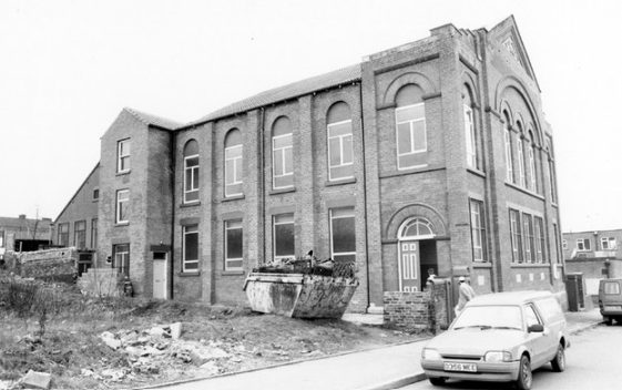 Building work at the masjid in 1991 with a skip outside